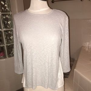 Gray long sleeve with lace button down in back.